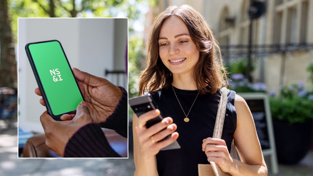 Woman looking at phone and NS&I logo