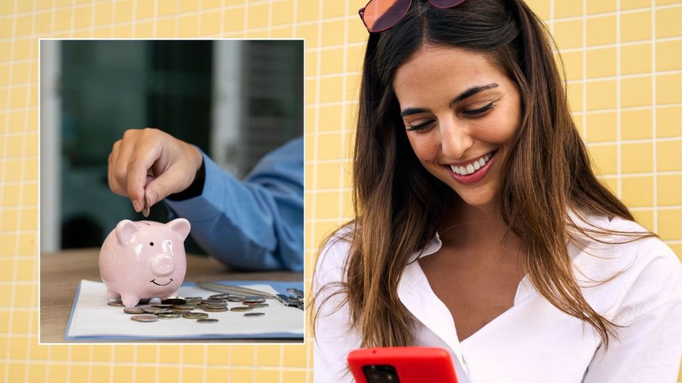 Woman looking at phone and piggy bank