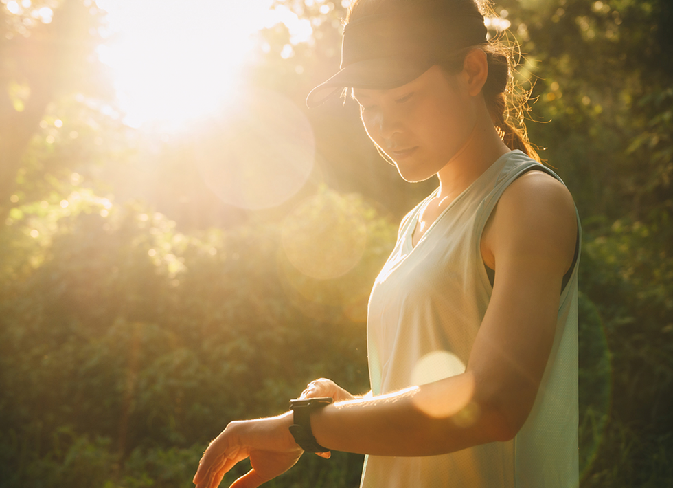 Woman looking at watch fitness