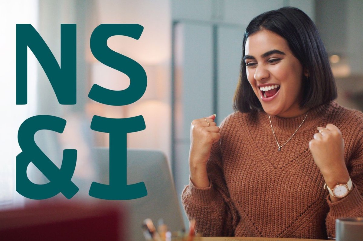 Woman looking happy at laptop and NS&I logo