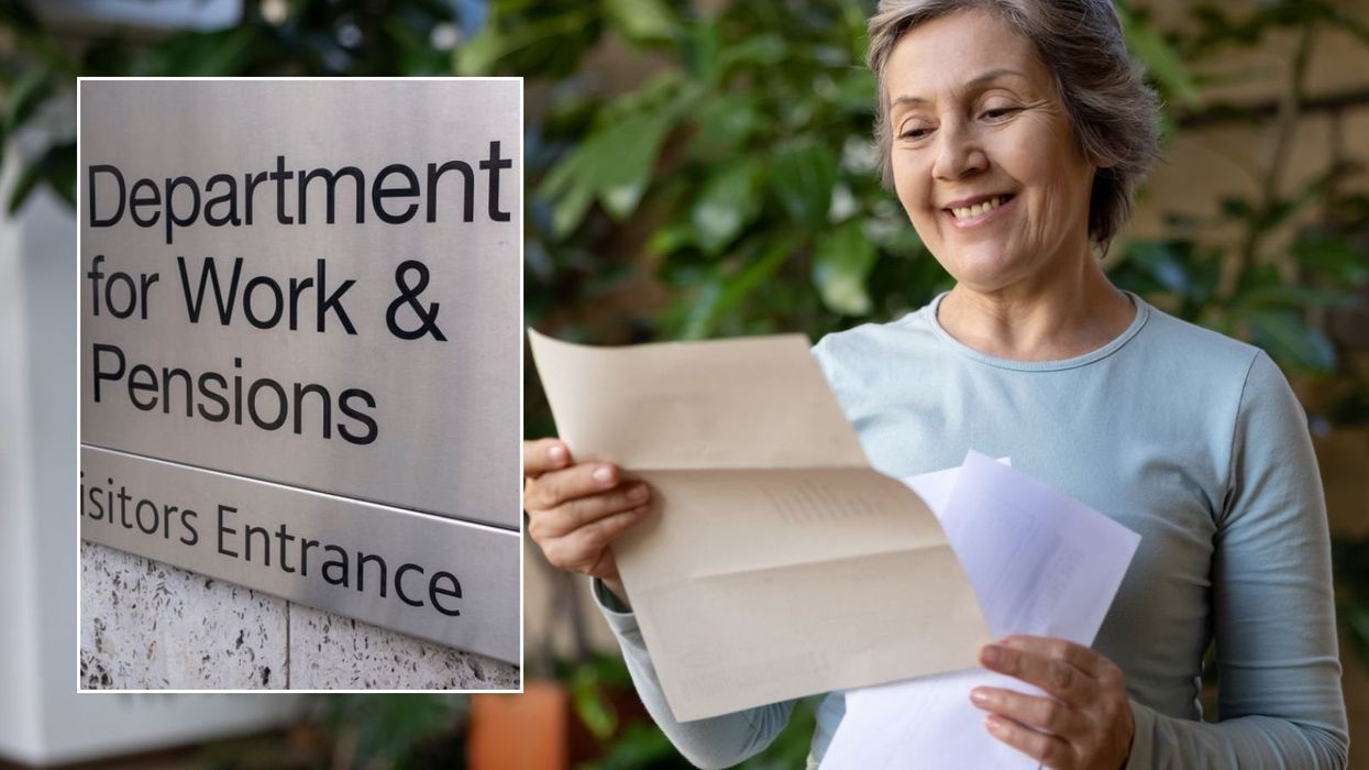 Woman looking letter and DWP sign