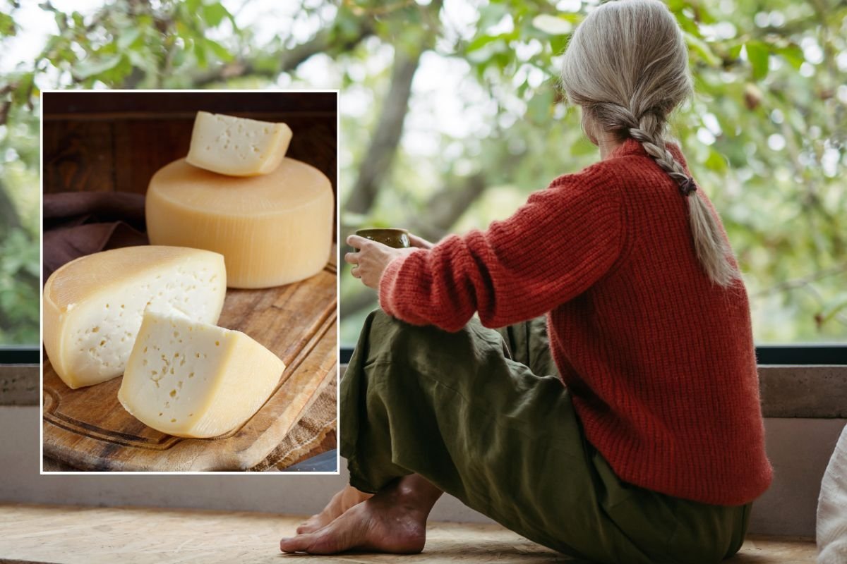 WOMAN LOOKING OUT WINDOW