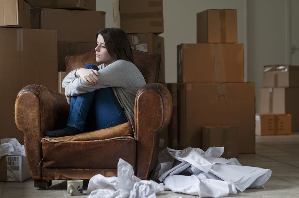 Woman looking sad after moving house