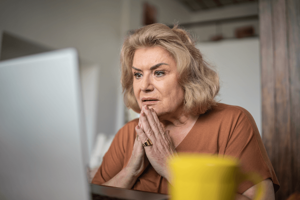 Woman looking stressed at computer