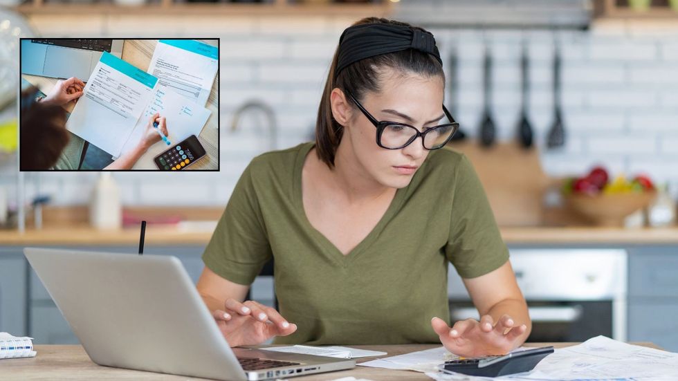 Woman looking through her bills