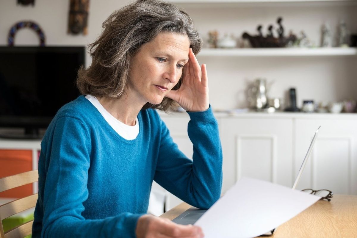 Woman looks worried about finances