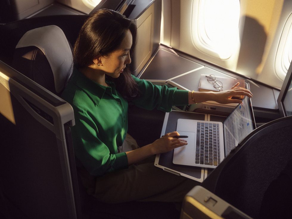 Woman on laptop on BA flight