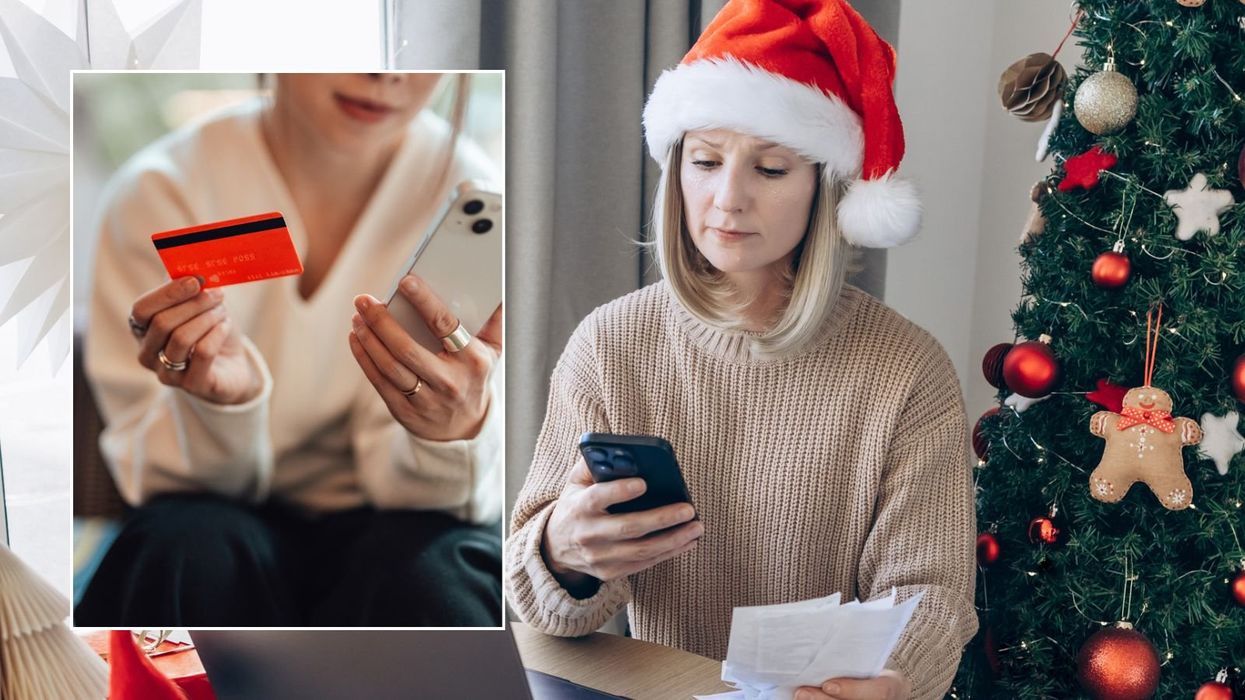 Woman on phone anc credit card