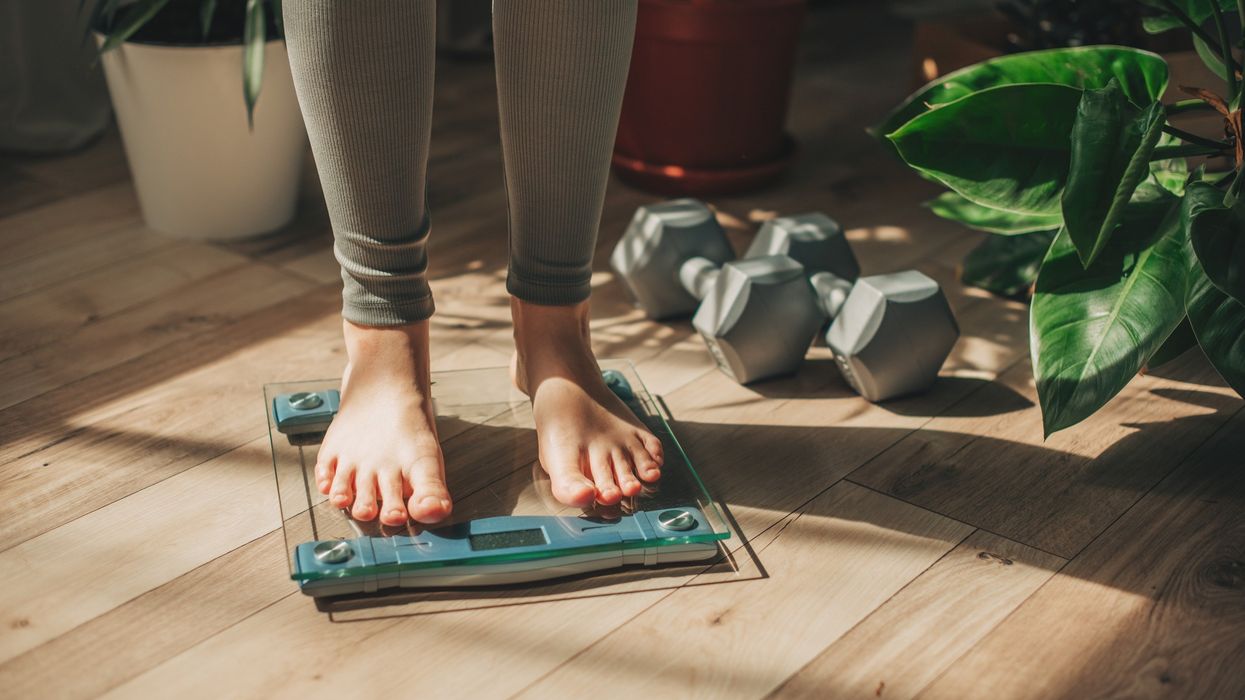 WOMAN ON SCALES
