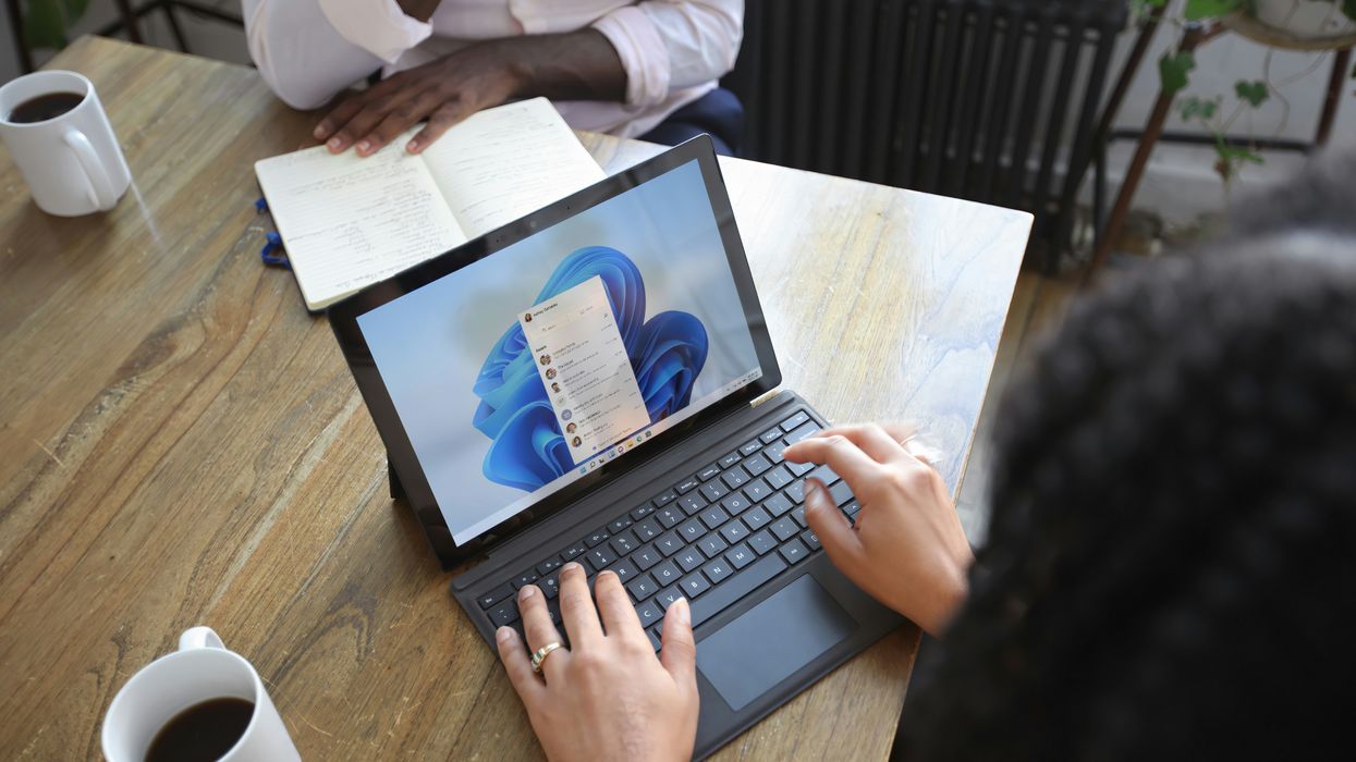 Woman opening Outlook on her laptop