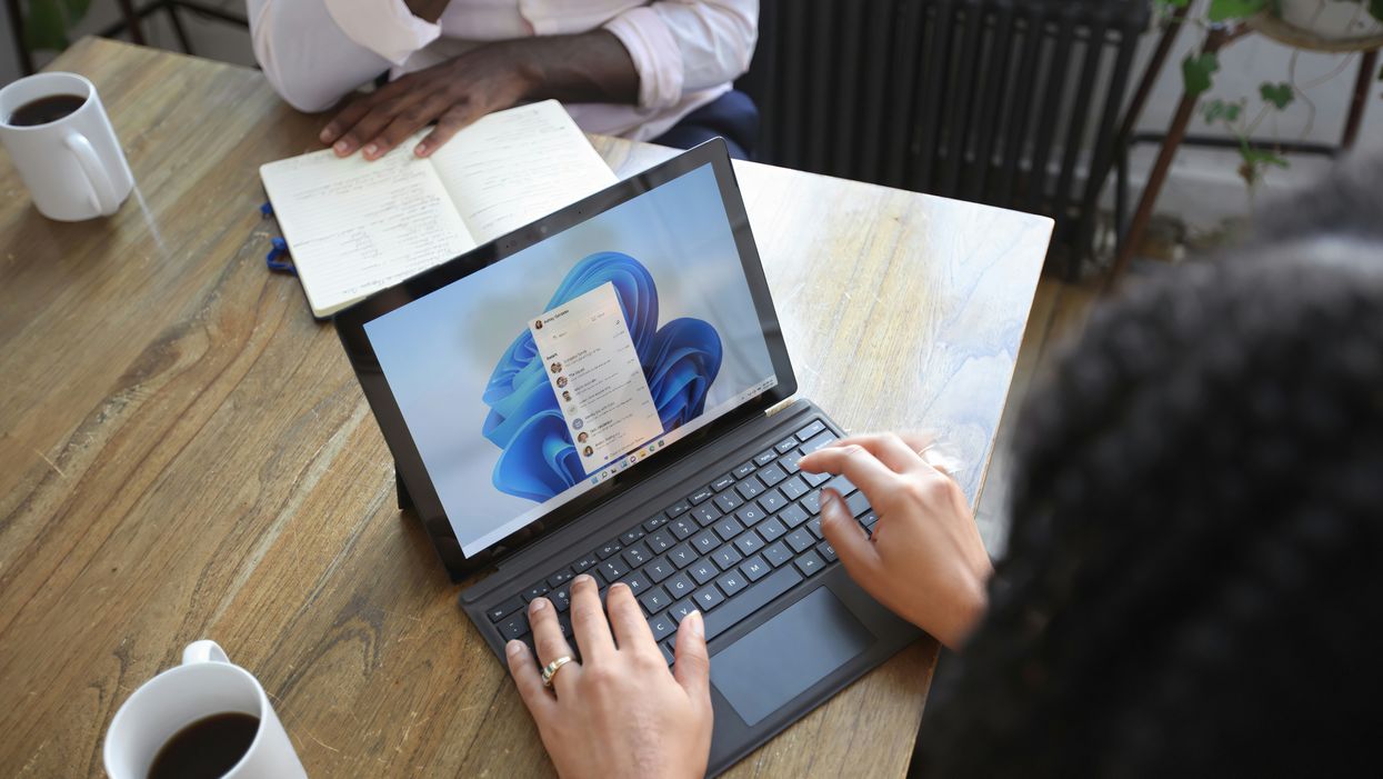 Woman opening Outlook on her laptop