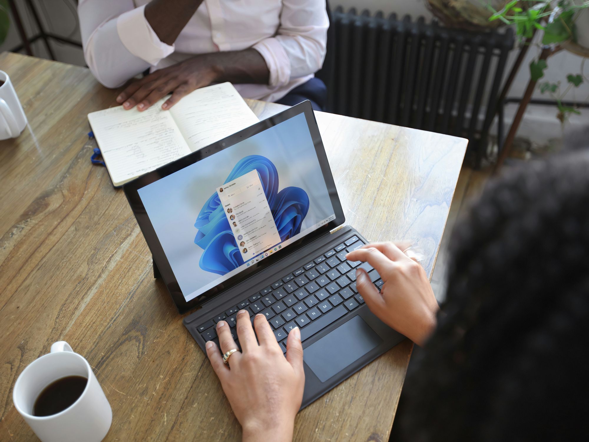 Woman opening Outlook on her laptop