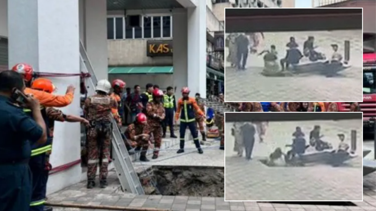 Woman plunges down 26ft sinkhole as pavement collapses