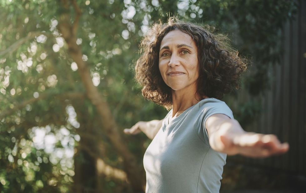 Woman practicing yoga outside