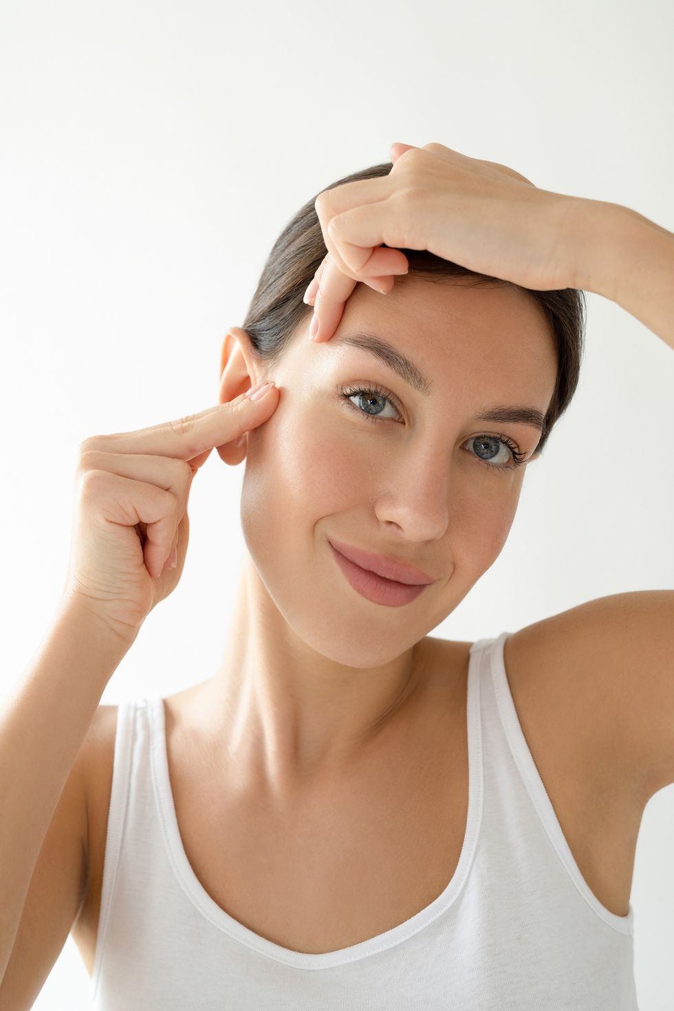 Woman practising facial yoga