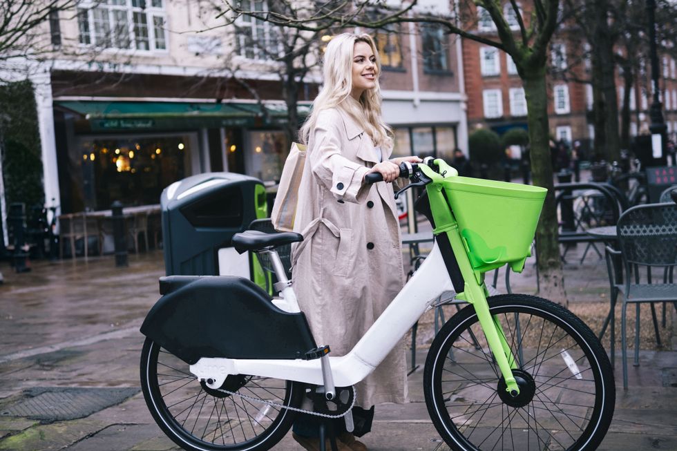 Woman pushing an e-bike
