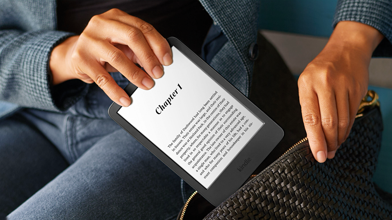 woman puts amazon kindle 2024 into a bag wearing jeans