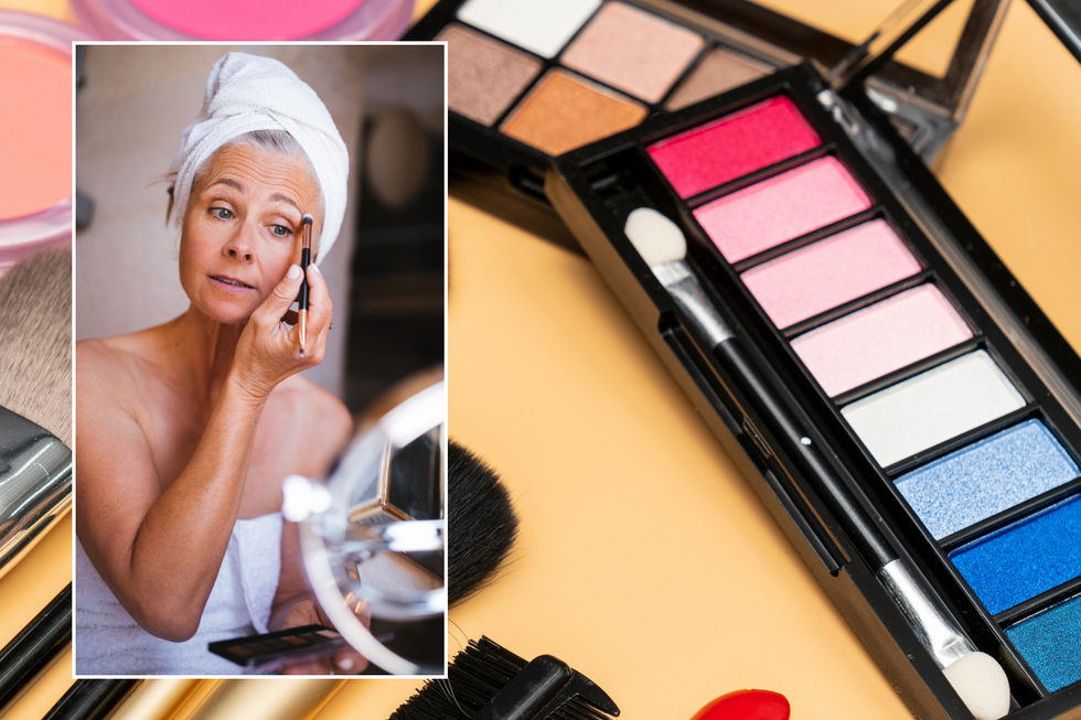 Woman putting on eyeshadow / make-up