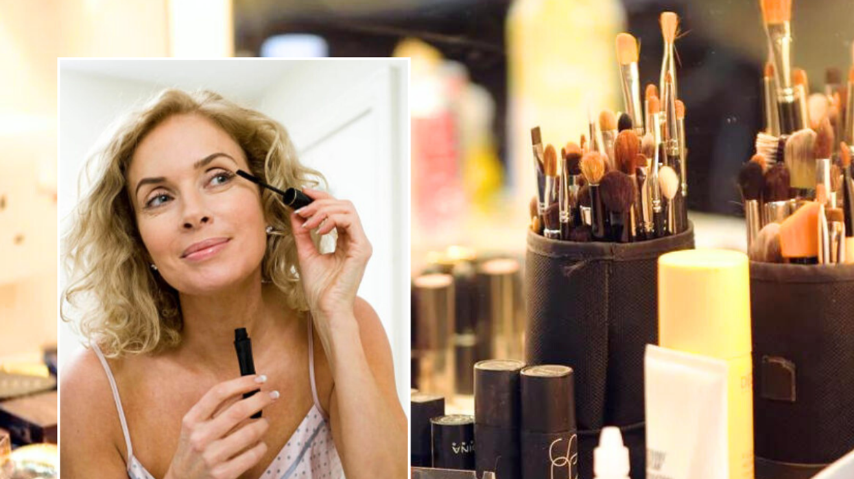 Woman putting on mascara / make-up