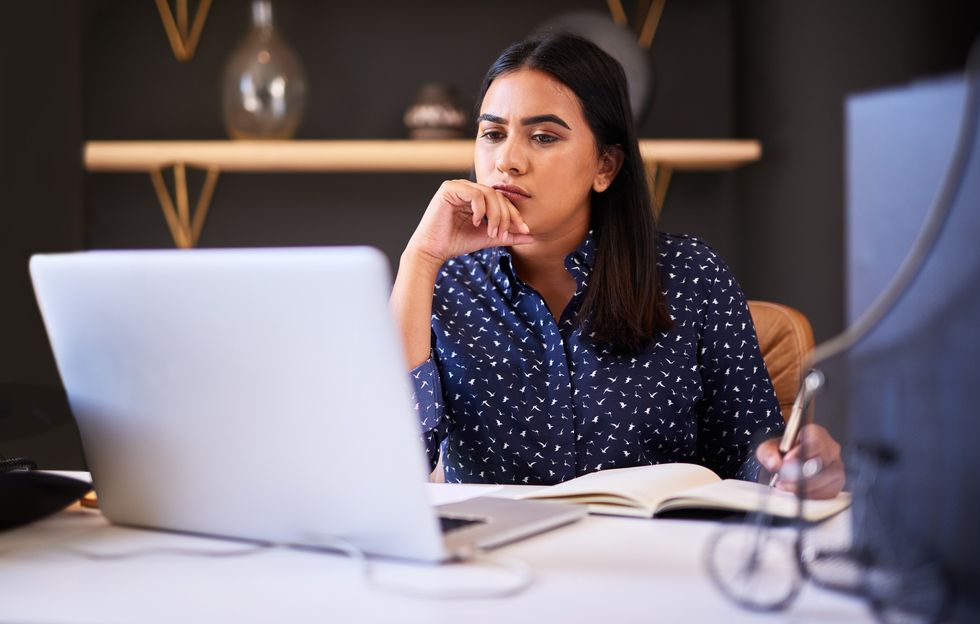 Woman reading laptop