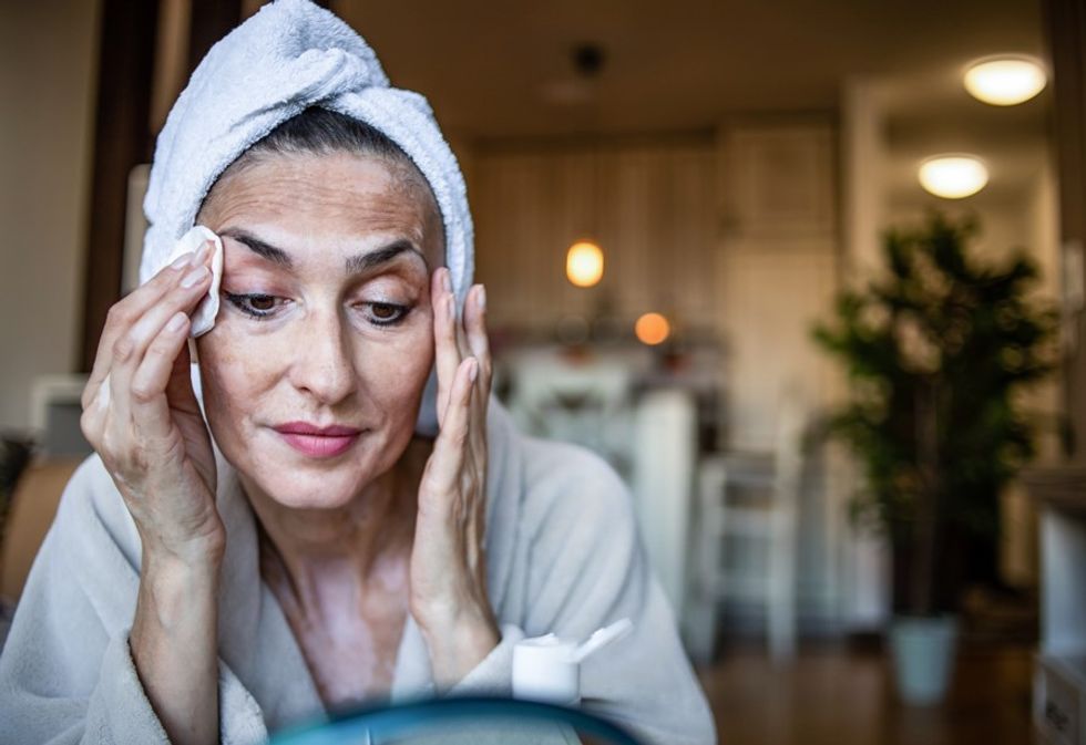 Woman removing makeup