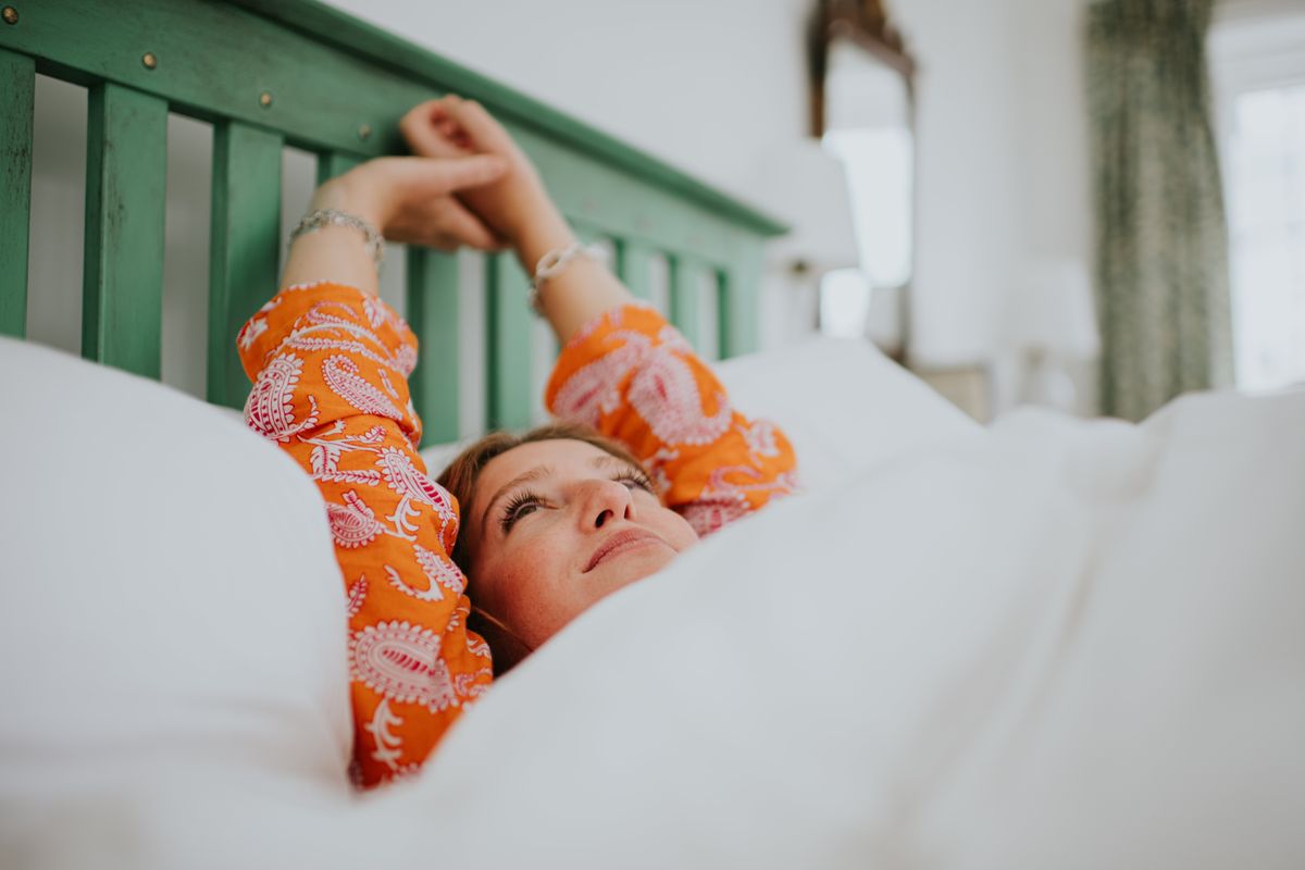 Woman resting on mattress topper