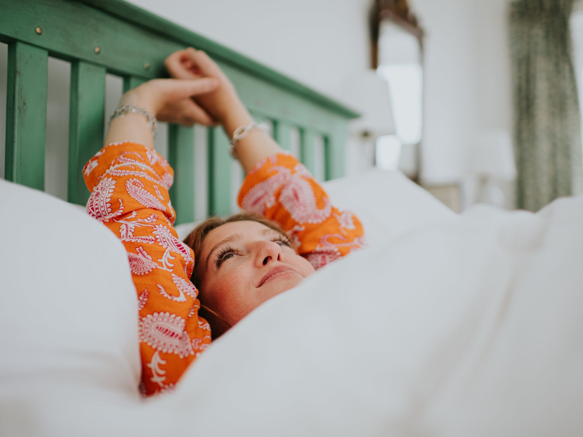 Woman resting on mattress topper