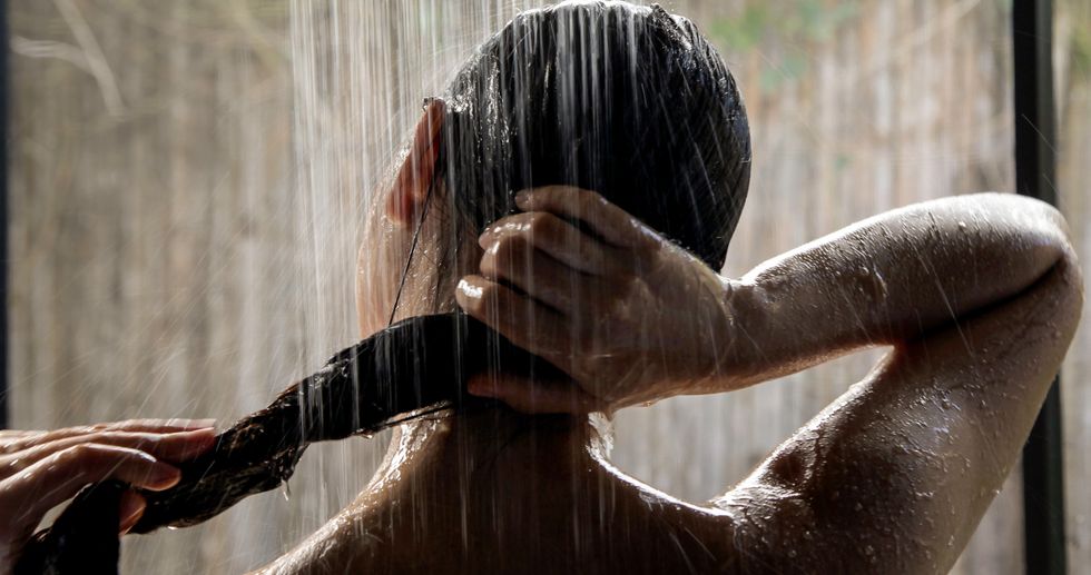 Woman rinsing her hair