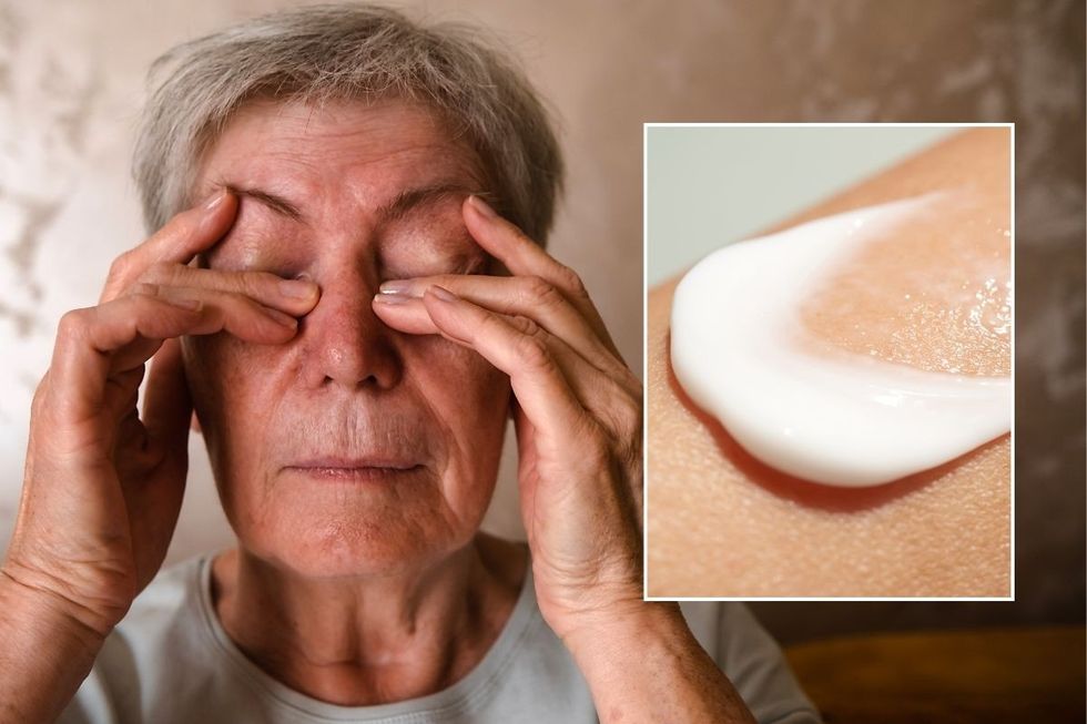 woman rubbing eyes -
