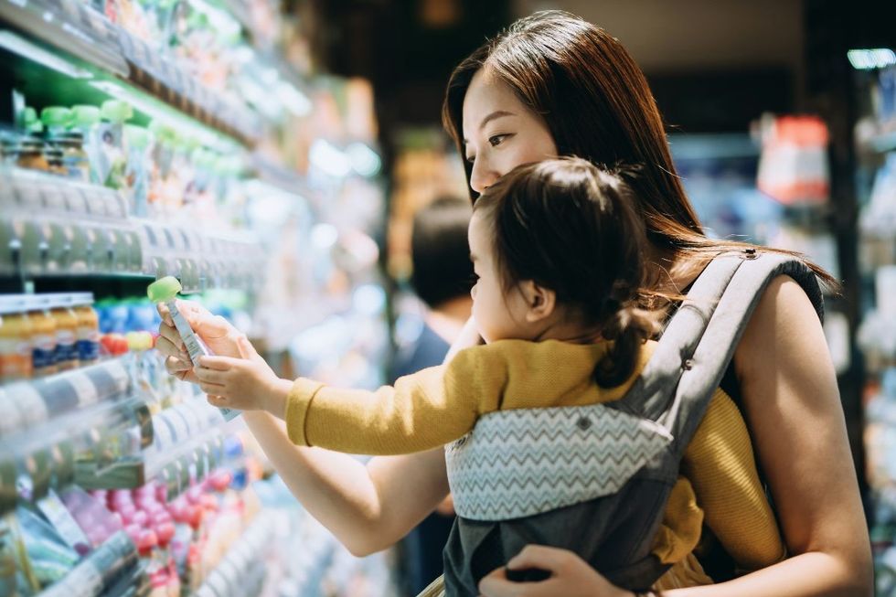 Woman selecting baby food