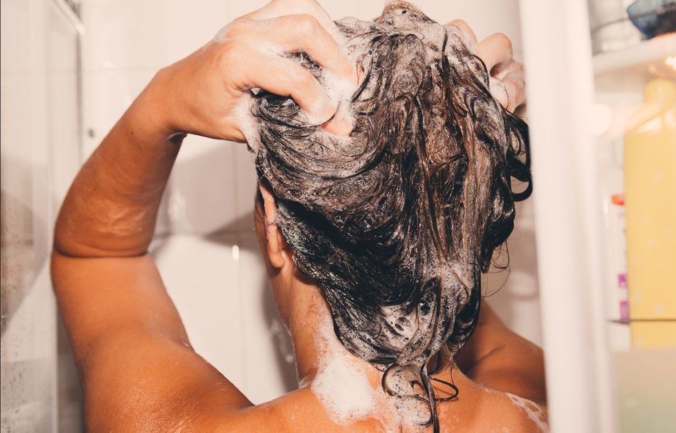 woman shampooing in shower
