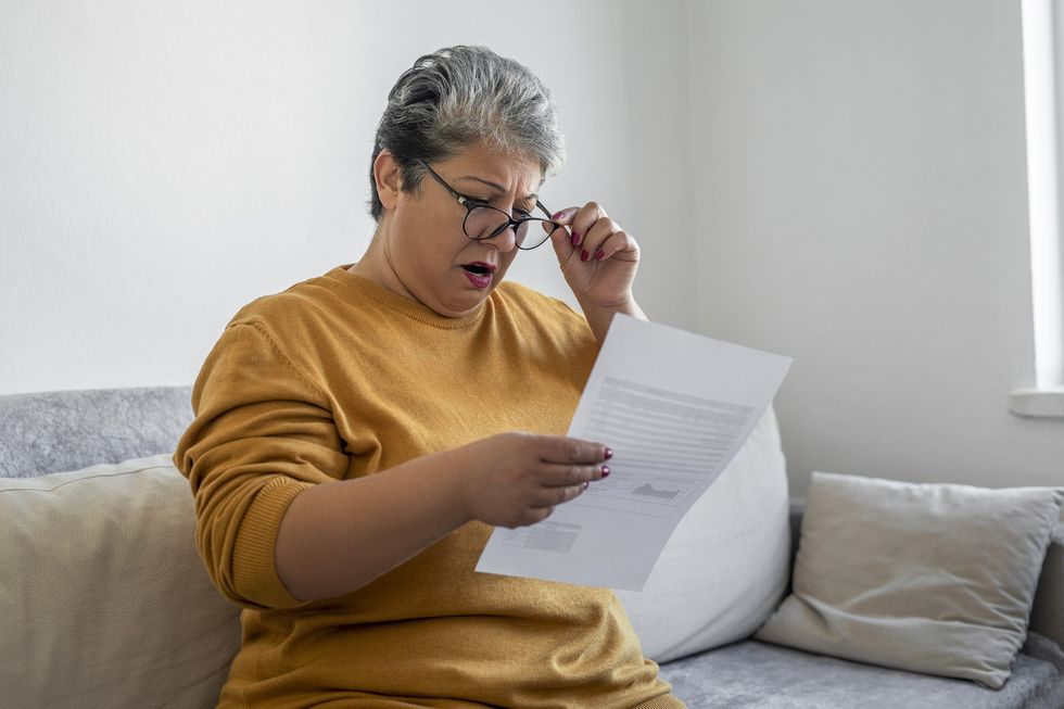 Woman shocked at laptop