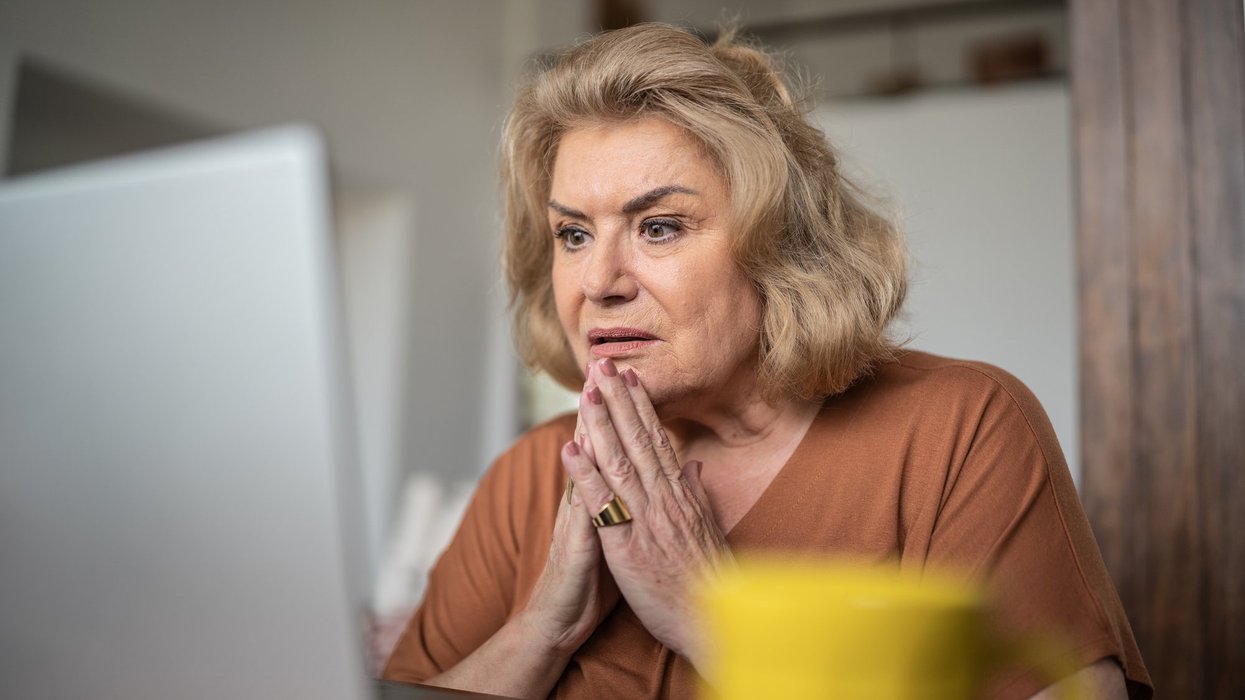 Woman shocked at laptop