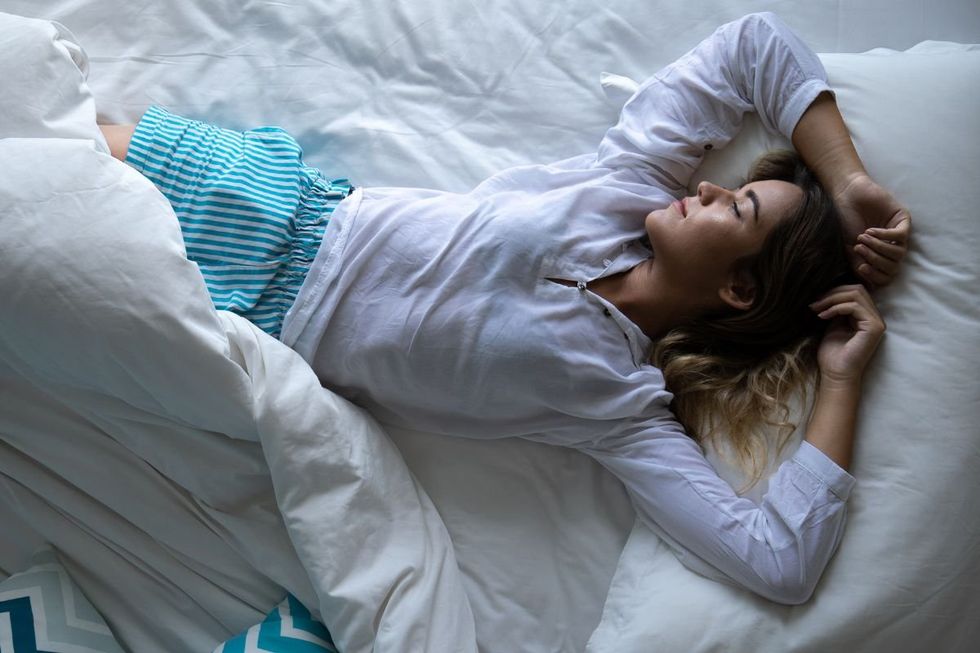 WOMAN SLEEPING ON BACK