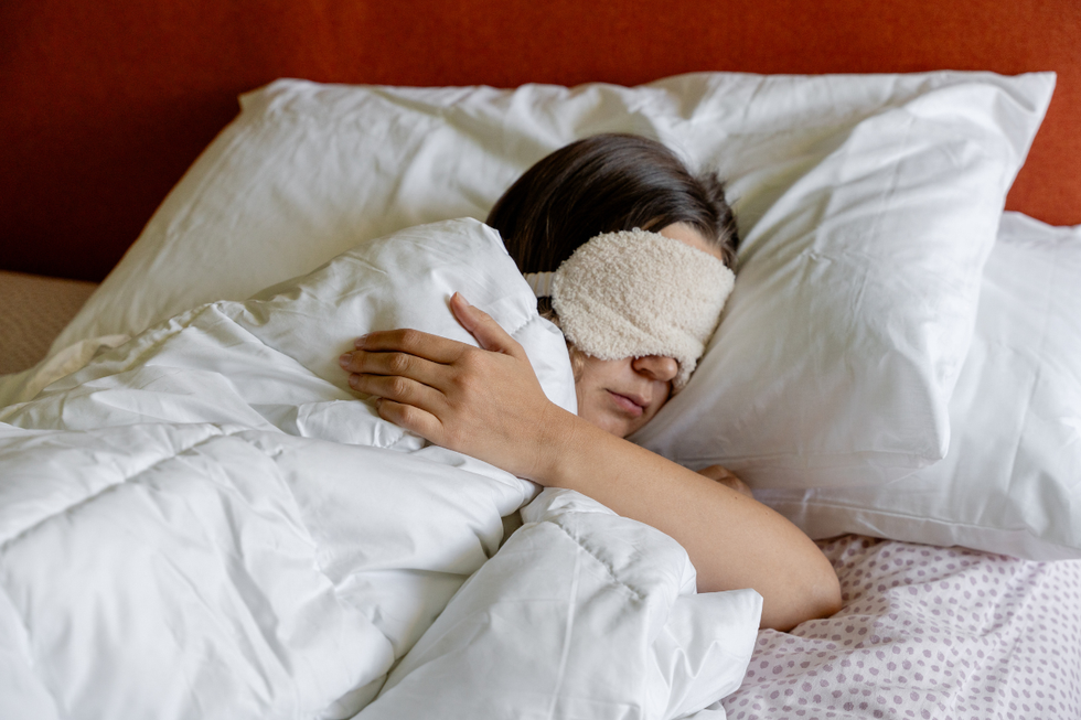 Woman sleeping with an eye mask
