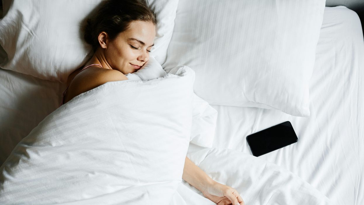 Woman sleeping with duvet