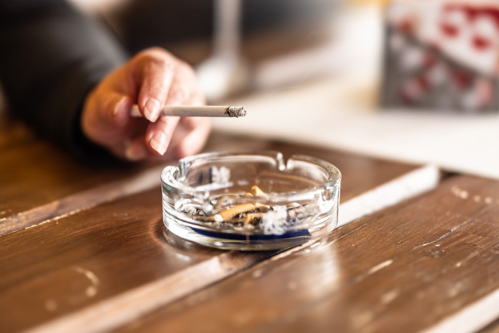 Woman smoking, ashtray