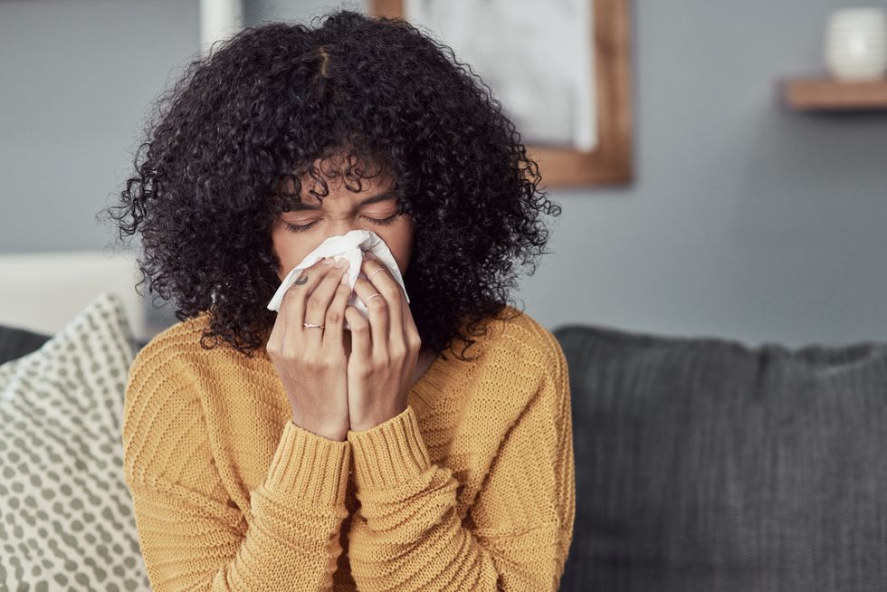 Woman sneezing