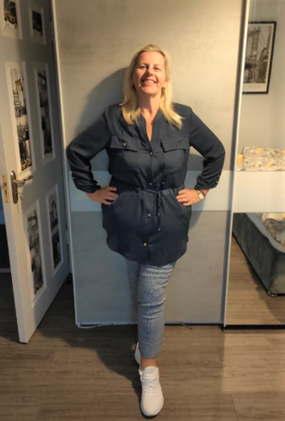 Woman standing after losing weight