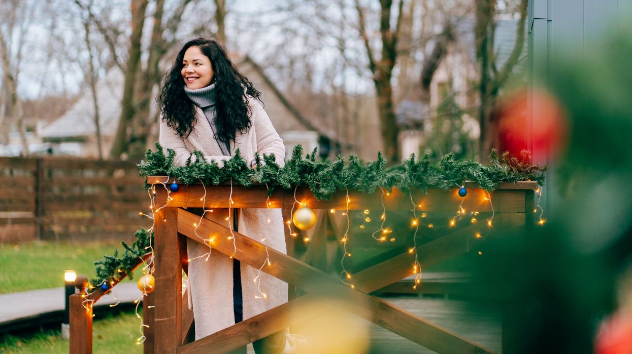 Woman standing in garden over Christmas