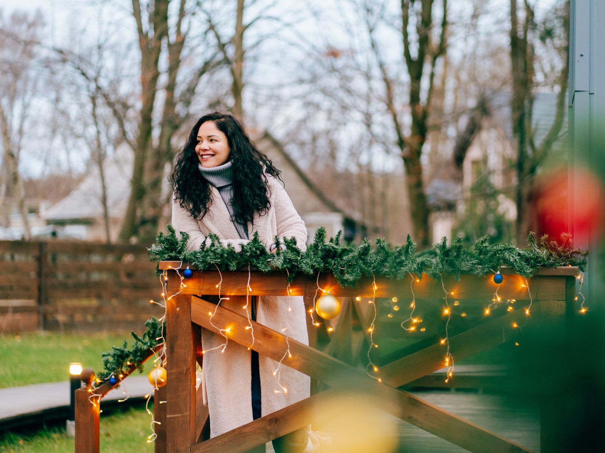 Woman standing in garden over Christmas