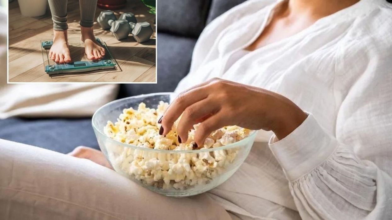Woman standing on scales / Eating popcorn