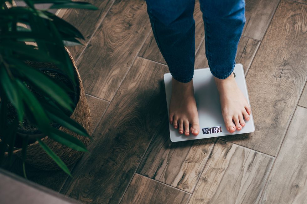 woman standing on scales