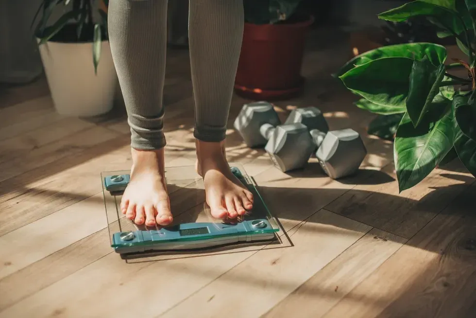 woman standing on scales