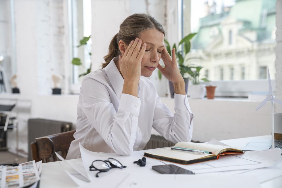 Woman stressed at her desk