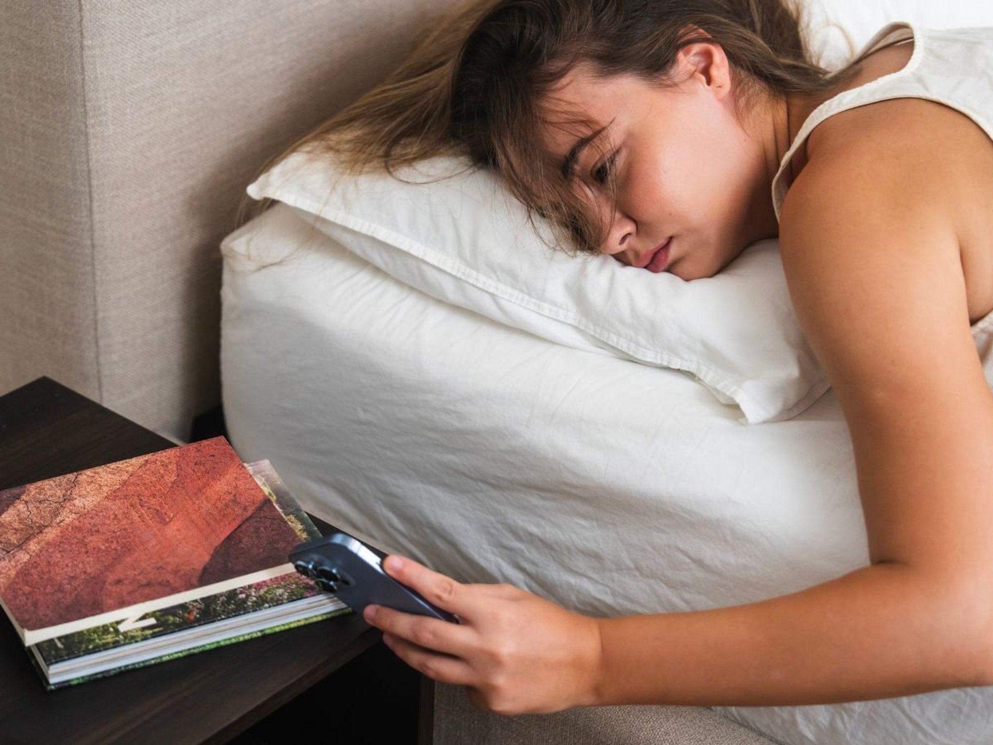 Woman struggling to sleep in bed