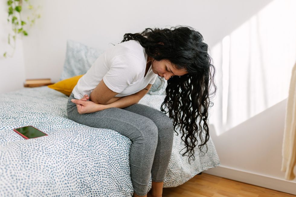 Woman struggling with stomach pain