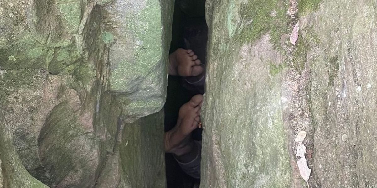 NextImg:Woman left stuck UPSIDE DOWN for SEVEN HOURS while trying to retrieve phone from crevasse
