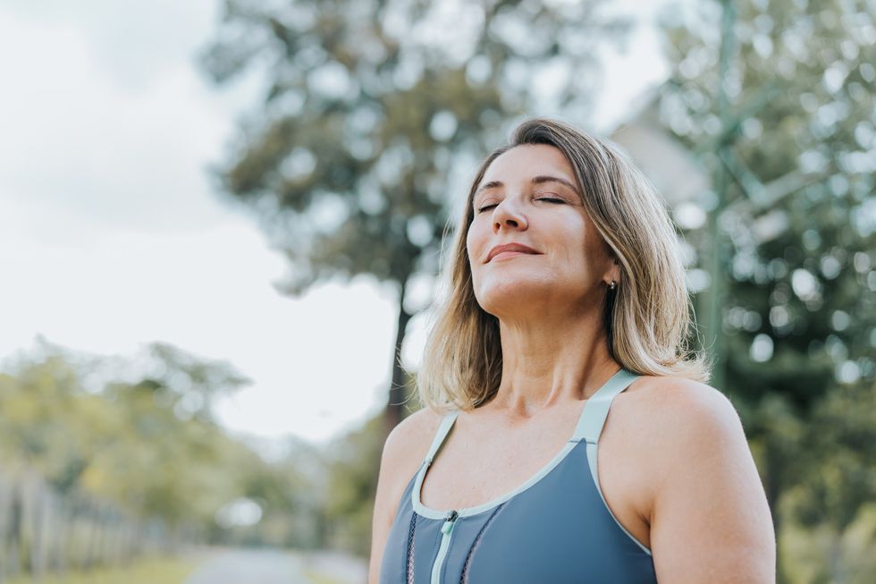 Woman taking a deep breath