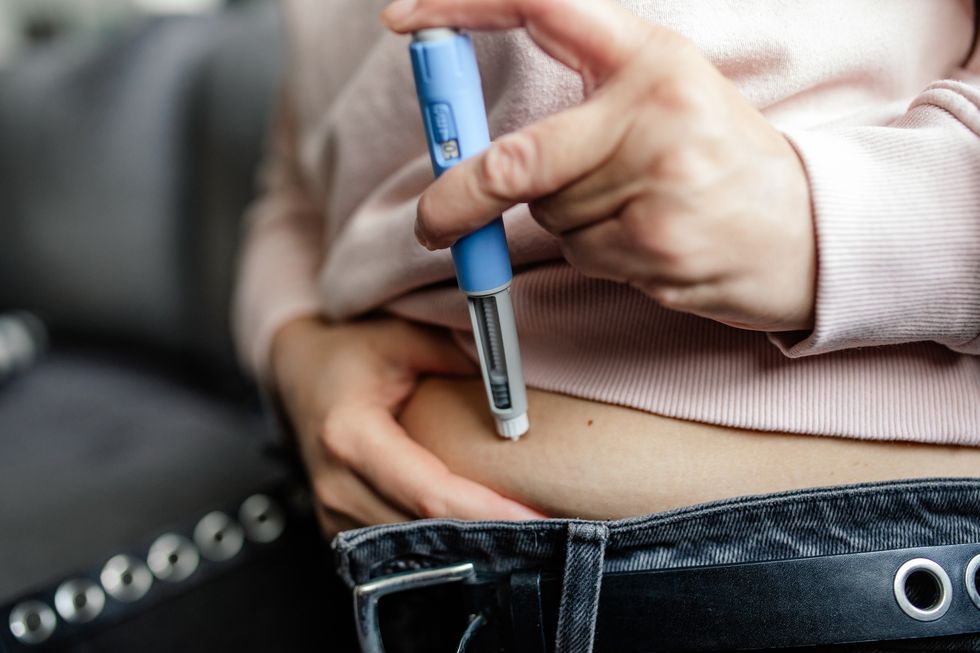 Woman taking a fat jab